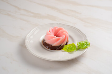 Strawberry and chocolate Pudding with sauce on white plate. Perfect for recipes, articles or any cooking content