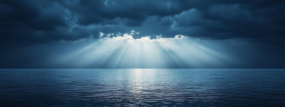 Panoramic view of beautiful calm ocean with stormy sky through which sun rays shine through - Powered by Adobe