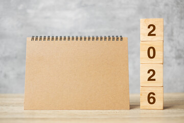 2026 Happy New Year with blank notebook and wooden number. countdown, Resolution, Goals, Plan, Action and Mission Concept