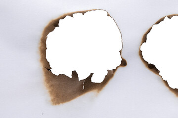 burn white paper sheet burnt edges.burnt effect with flame and ash. Torn and scorched paper...