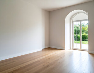 Fototapeta premium Bright, empty room with white walls, wooden floor, and an arched window looking out to a green garden. Perfect for interior design or property listings.