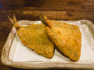 Close-up of a delicious fried fish meal on a plate