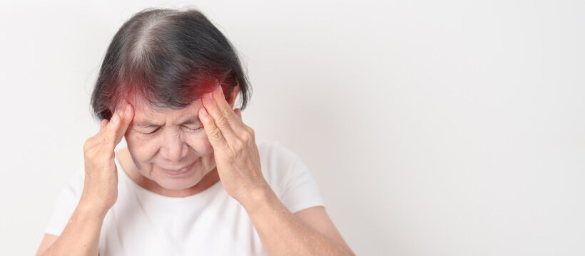 Elderly Woman having headache and Dizzy for concepts of Chronic Stress, Headache and Migraine, World Brain Tumor day, Brain Cancer, Brain Stroke, Dementia, alzheimer, Hypotension and mental health - Powered by Adobe