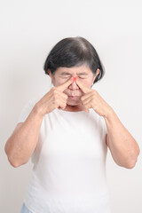 Elderly  Woman having Nose pain for concepts of Nose disease, Common Cold, Influenza, Flu, Covid...