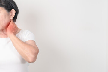 Elderly Woman having Neck pain for concepts of Neck Muscle Strain and Inflammation, Myofascial pain...