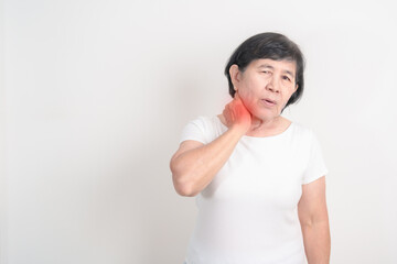 Elderly Woman having Neck pain for concepts of Neck Muscle Strain and Inflammation, Myofascial pain syndrome and Fibromyalgia, Rheumatism, Cervical Spine Spondylosis, Osteoporosis and Health care