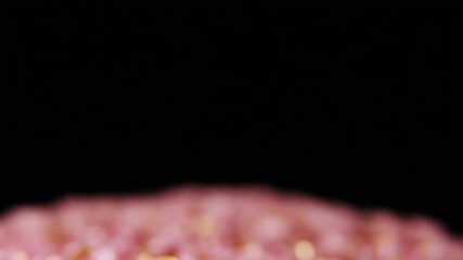 Pink and gold confetti falling creating festive atmosphere