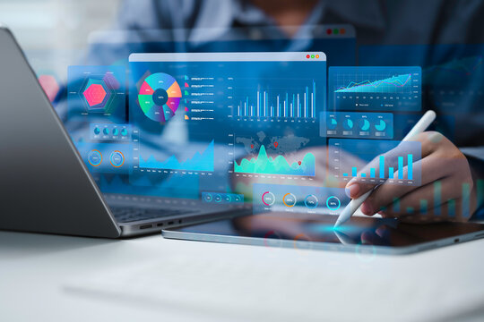 An Analyst uses a computer and dashboard for data business analysis and Data Management System with KPI to report. Database for technology finance, operations, sales, marketing and SEO
