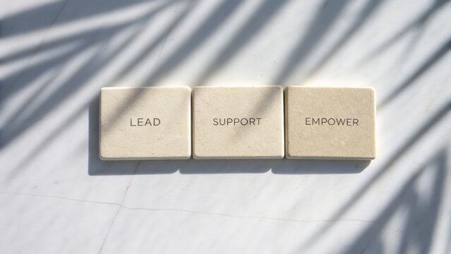 Inspiring words lead support empower displayed on neutral background