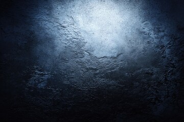 Dark textured wall with a light source