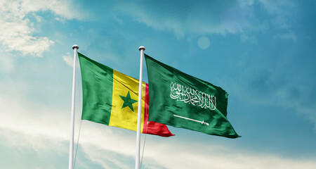 Senegal and Saudi Arabia friendship flags are waving in the sky. Two country flag for agreement or deal. Senegal KSA national flag for commitment.