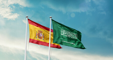 Spain and Saudi Arabia friendship flags are waving in the sky. Two country flag for agreement or deal. Spain KSA national flag for commitment.