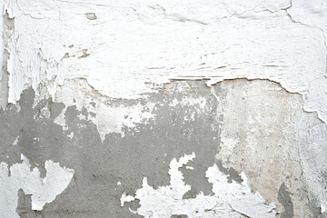 Peeling dirty old cracked stucco painted concrete wall. Leaking rain cause the wall cracked. Water damaged the wall. Uneven render surface.