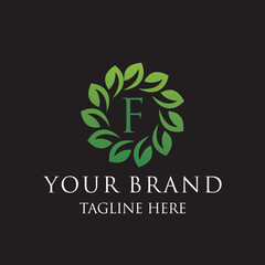 Initial letter F green leaves organic natural logo design, cosmetics and beauty vector icon concept