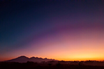 landscape photo of sunset at the rice paddy field