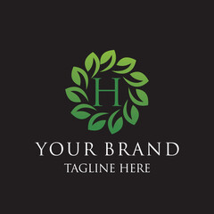 Initial letter H green leaves organic natural logo design, cosmetics and beauty vector icon concept