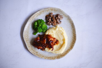 chicken steak with mashed potato and vegetables 