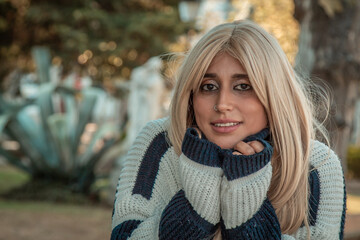 portrait of a beautiful happy plus size woman in the park