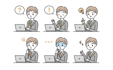 パソコンを使うスーツを着た男性