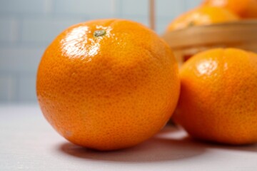 Orange, fresh tangerines on white table background	