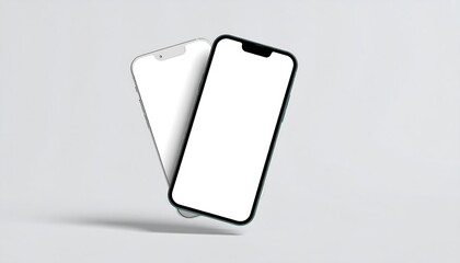 Two blank screen smartphones on a light gray surface.