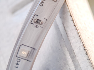 Close-up of a Flexible LED Strip Light with Resistor and Control Components