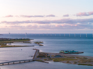 Aerial view of Copenhagen, Denmark, showing a coastal landscape with offshore wind turbines, a...