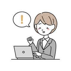 パソコンの前で喜ぶスーツを着た女性