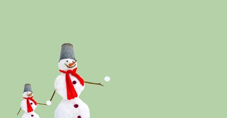 Snowman with a red scarf. Snow, winter symbolism, winter activities. Christmas-themed postcard, poster. Negative space	