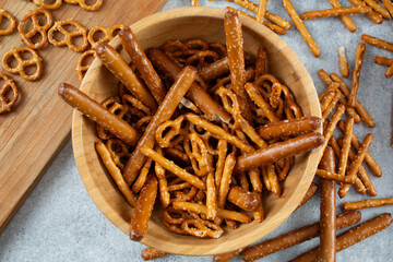 A top down view of a bowl of assorted gluten-free pretzels.