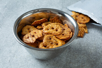A view of a bowl of gluten-free pretzel crackers.