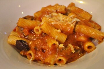 Italian cuisine: rigatoni with beef strips and tomato sauce in Venice, Italy