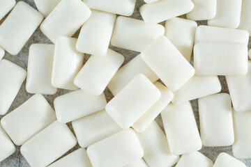 A top down view of a pile of gum tablets, as a background.