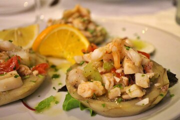 Italian cuisine: seafood salad with artichokes in Venice, Italy