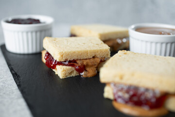 A closeup view of gluten-free almond butter and jelly sandwich bites.