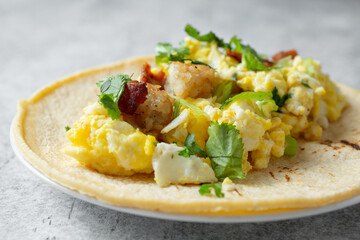 A closeup view of a breakfast taco.