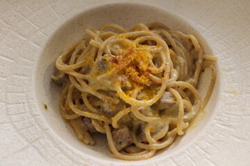 Italian cuisine: spaghetti with fish carbonara in Venice, Italy