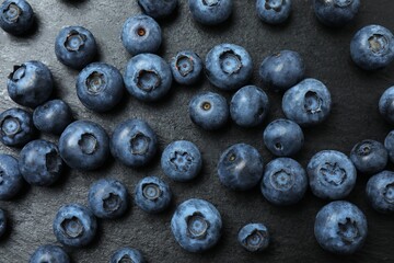 Blueberries on black background. Vegetarian concept. Blueberry macrostructure. Blueberry texture close-up