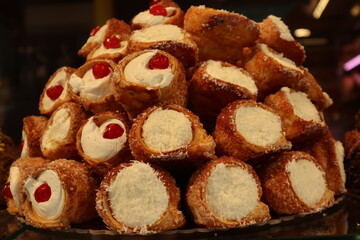 Pastry vitrine filled with varieties of cannoli in Venice, Italy