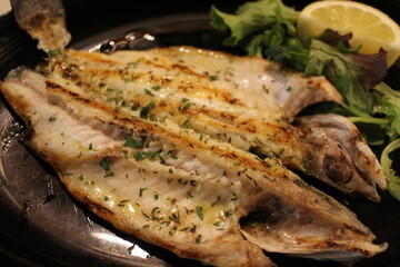 Italian cuisine: grilled sea bass in Venice, Italy