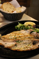 Italian cuisine: grilled sea bass in Venice, Italy