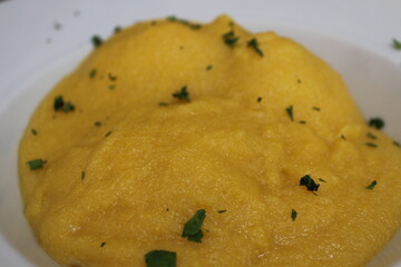 Italian cuisine: polenta over baccalà (dried and salted cod) in Venice, Italy