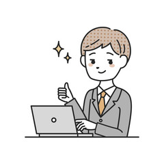 パソコンの前でサムズアップをするスーツを着た男性