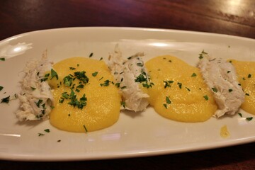 Italian cuisine: baccalà (dried and salted cod) with polenta in Venice, Italy