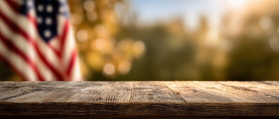 The rustic wooden table with a blurred American flag background in sunlight.