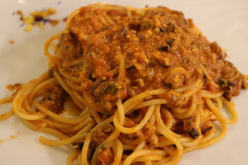 Italian cuisine: spaghetti with tomato sauce and mussels in Venice, Italy