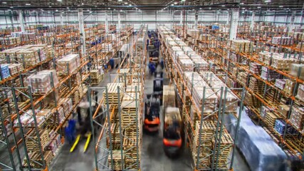 Time-lapse of workers in a busy warehouse preparing goods for dispatch. - Powered by Adobe