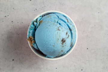 A top down view of a blue cookie ice cream scoop.