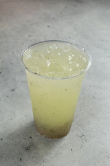 A view of a cucumber lime agua fresca drink, with chia seeds.