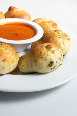 A view of a plate of garlic knots.